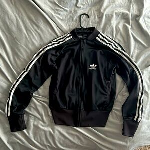 A cropped Adidas jacket